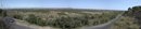 Panorama sur la basse plaine de l'Aude depuis la route à flanc de coteau accrochée à la montagne de la Clape vers Fleury