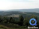  Vue dgage vers le nord et les pentes sombres boises de la montagne du Goulet, avec en contrebas les valles naissantes du Lot et de l'Altier autour du Bleymard
