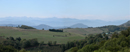 La silhouette bleuté des Pyrénées vue depuis les Hautes-Corbières : ligne d'horizon sud du département.